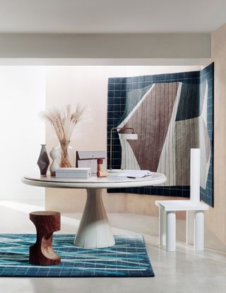 Deirdre Dyson carpet art blue rug with round table and rug on wall