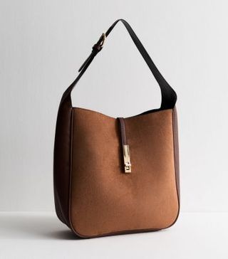 Image of brown suede handbag