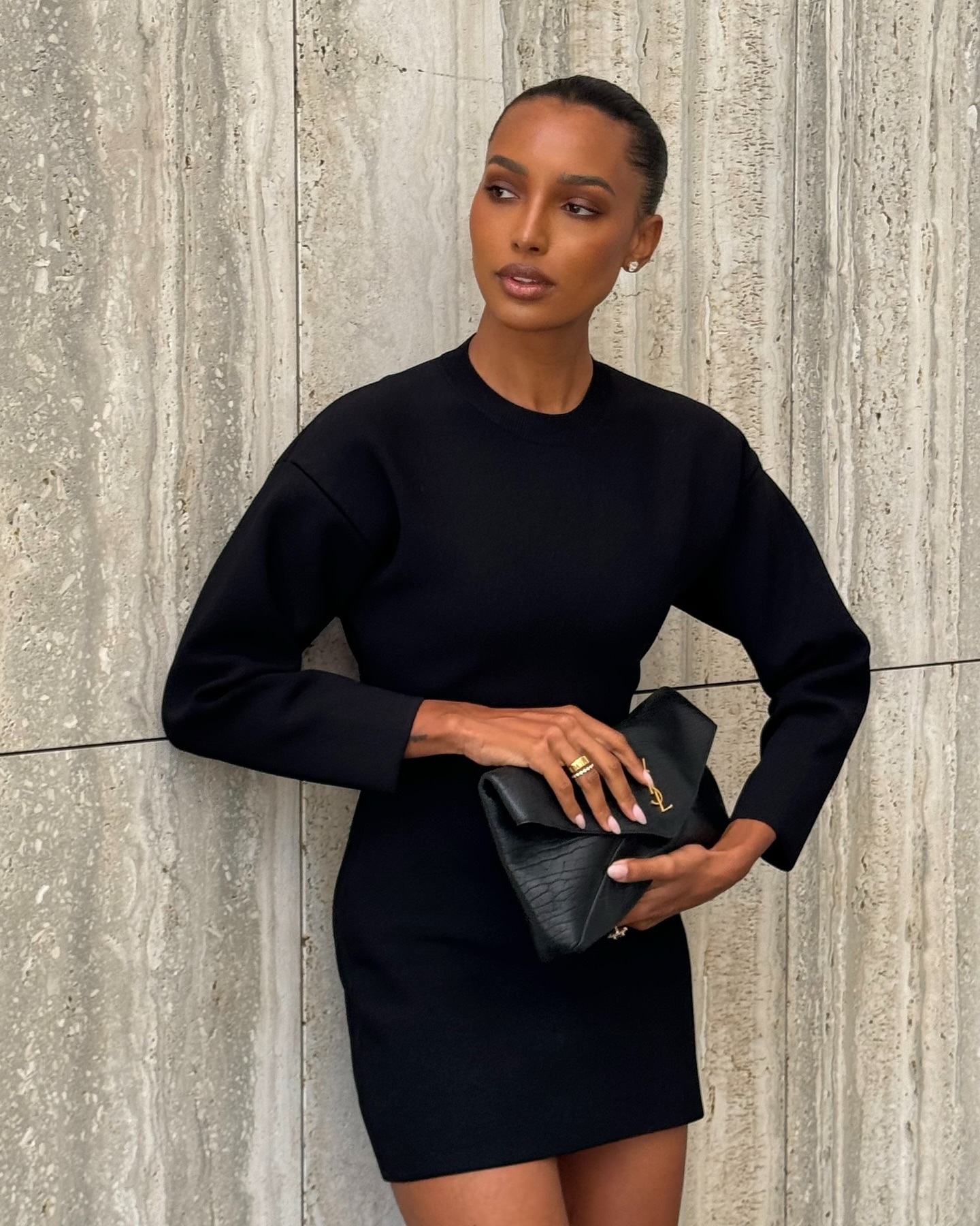 Woman wearing an elegant outfit idea that includes a blazer dress.