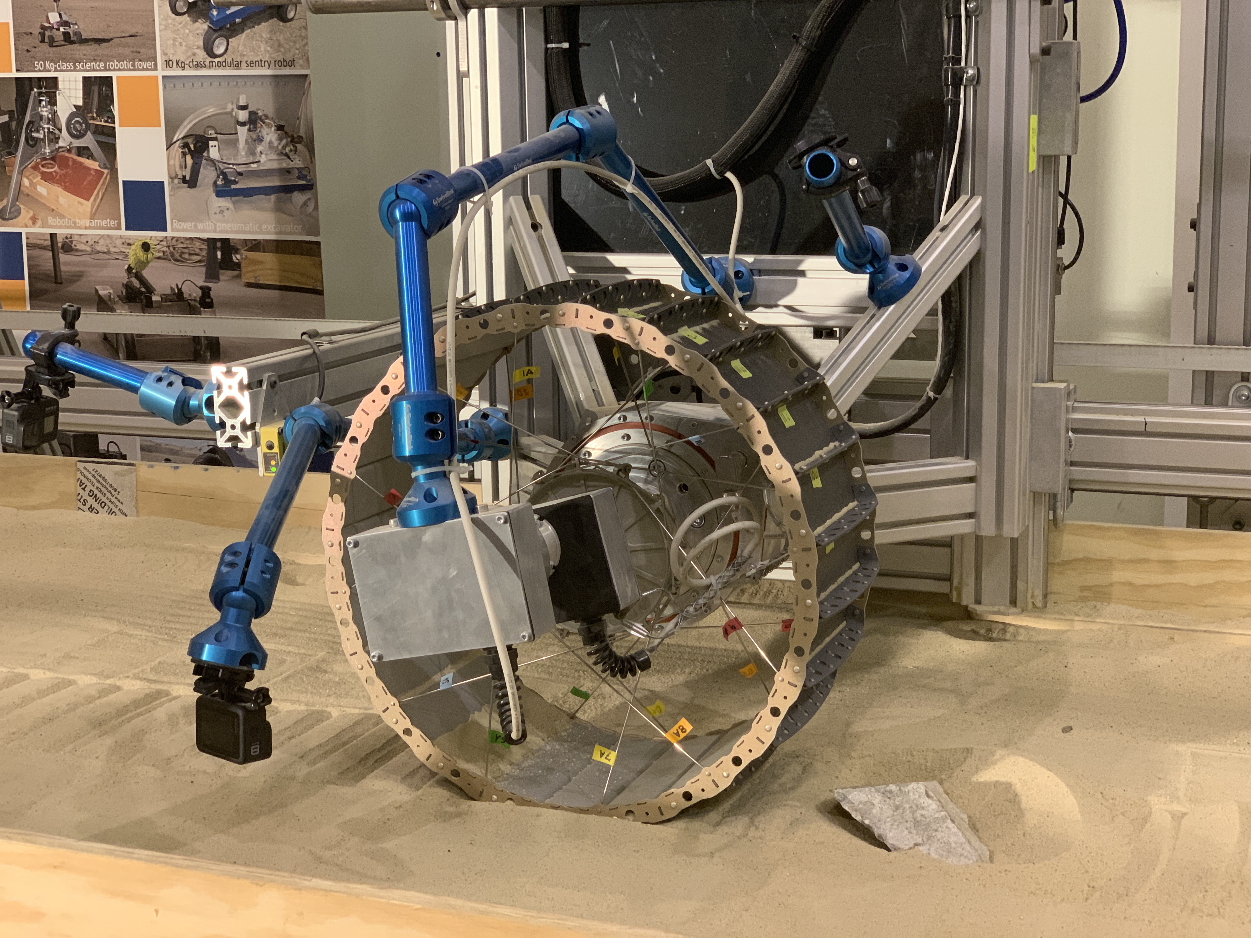 A wheel from NASA’s Volatiles Investigating Polar Exploration Rover, or VIPER, is run through endurance testing in a test bed containing lunar soil simulant and some of the most moon-like rocks on Earth, at ProtoInnovations in Pittsburgh.