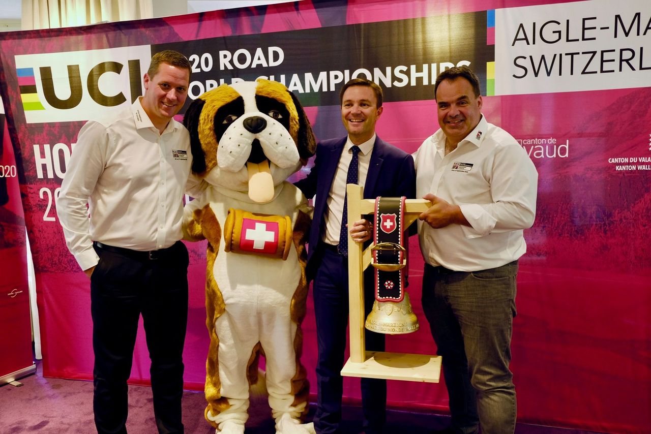 2020 UCI Road World Championships organisers Alexandre Debons and Gr&eacute;gory Devaud with UCI president David Lappartient &ndash; and event mascot Barry the St. Bernard &ndash; at the unveiling of the championships' routes