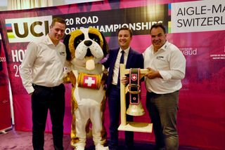 2020 UCI Road World Championships organisers Alexandre Debons and Grégory Devaud with UCI president David Lappartient – and event mascot Barry the St. Bernard – at the unveiling of the championships&#039; routes