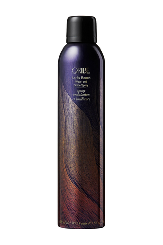 A bottle of Oribe Apres Beach set against a white background.