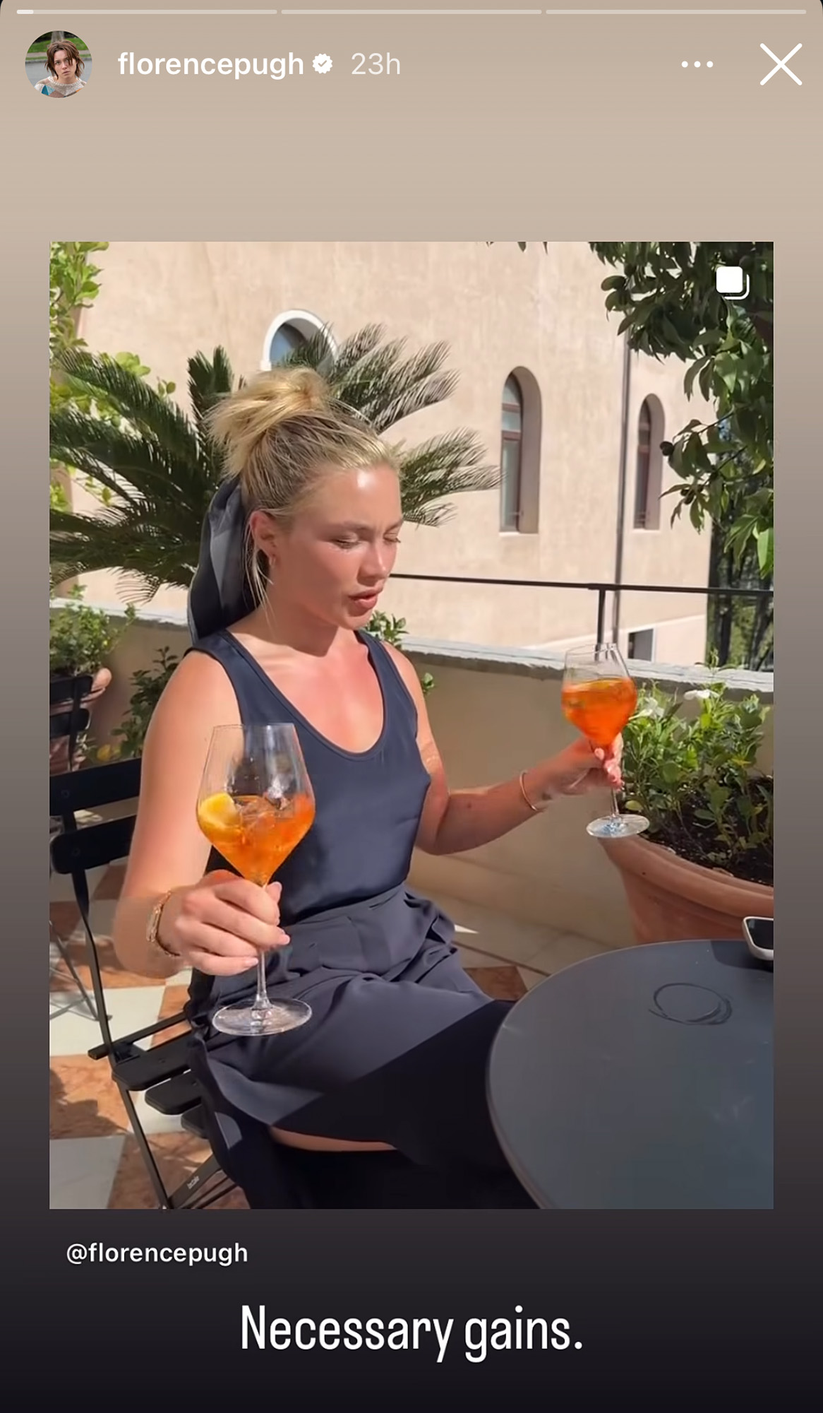 Florence Pugh balances two aperol spritzes while doing hammer curls for her trainer at the Venice Film Festival.