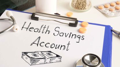 picture of a clipboard with "health savings account" written on it