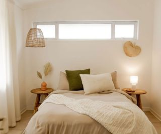 neutral small guest bedroom with high-level window