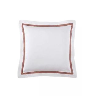 white pillowcase with brown square trim