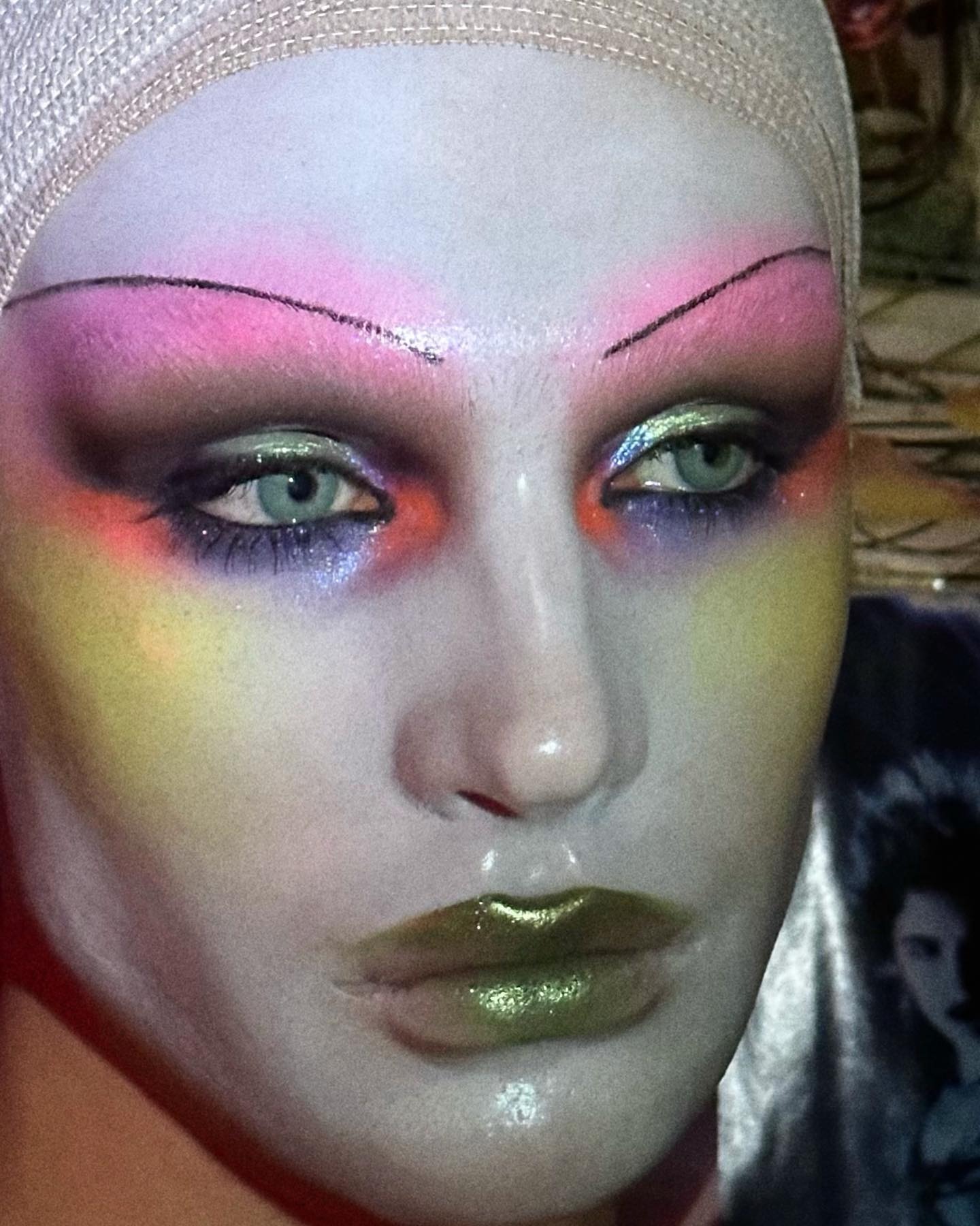 A selfie of Andrew Dahling wearing makeup inspired by the Pat McGrath runway makeup at Margiela's S/S 24 show.