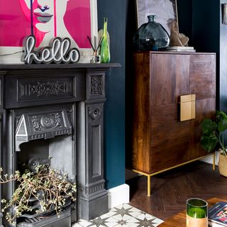 blue living room with fireplace and tiled hearth
