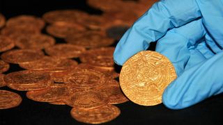 A family found this stash of gold coins while weeding in their garden.