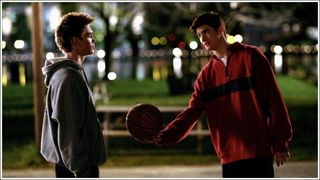 One Tree Hill's Nathan offering Lucas a basketball on the River Court