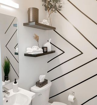 Bathroom with black chevron stripes on wall