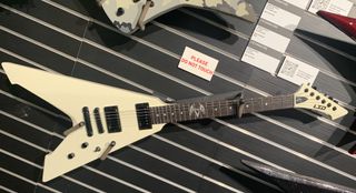 ESP's James Hetfield LTD Signature Series Vulture in Olympic White, displayed at the 2023 NAMM show