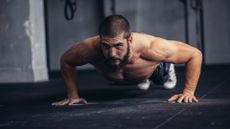 A man performing a push up at the gym