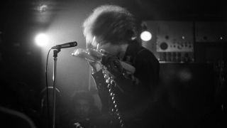 Jimi Hendrix performing live onstage at The Speakeasy in Margaret Street London W1, playing guitar with teeth 