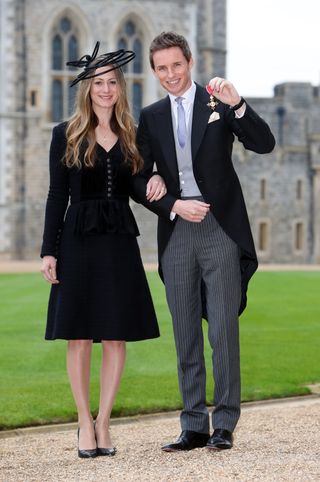 Eddie Redmayne wearing Alexander McQueen to meet the queen