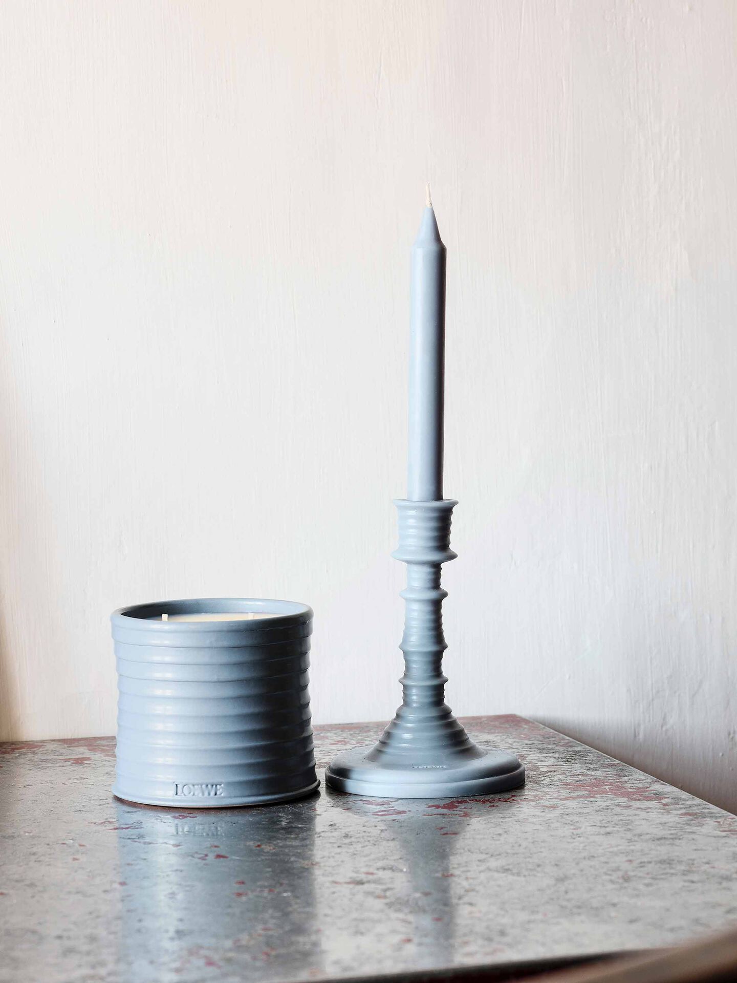 Loewe Cyprus Balls candles in blue ceramic holders