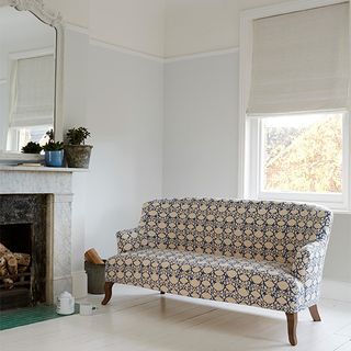 living room with prints charming sofa opposite of fire place