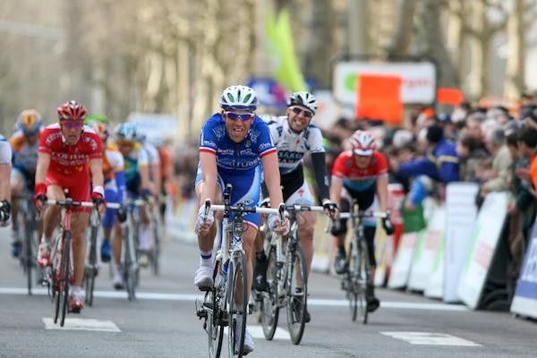 Christophe Moreau rolls in to the finish while Jens Voigt has a chuckle behind.