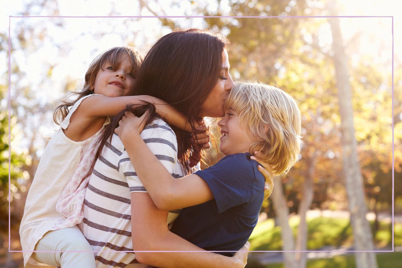 mother with her two children in a park