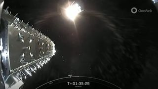 A view of the final OneWeb internet satellite separating from SpaceX's Falcon 9 upper stage after a successful launch on Dec. 8, 2022. The bright objects in the background are other OneWeb satellites deployed earlier in the mission.