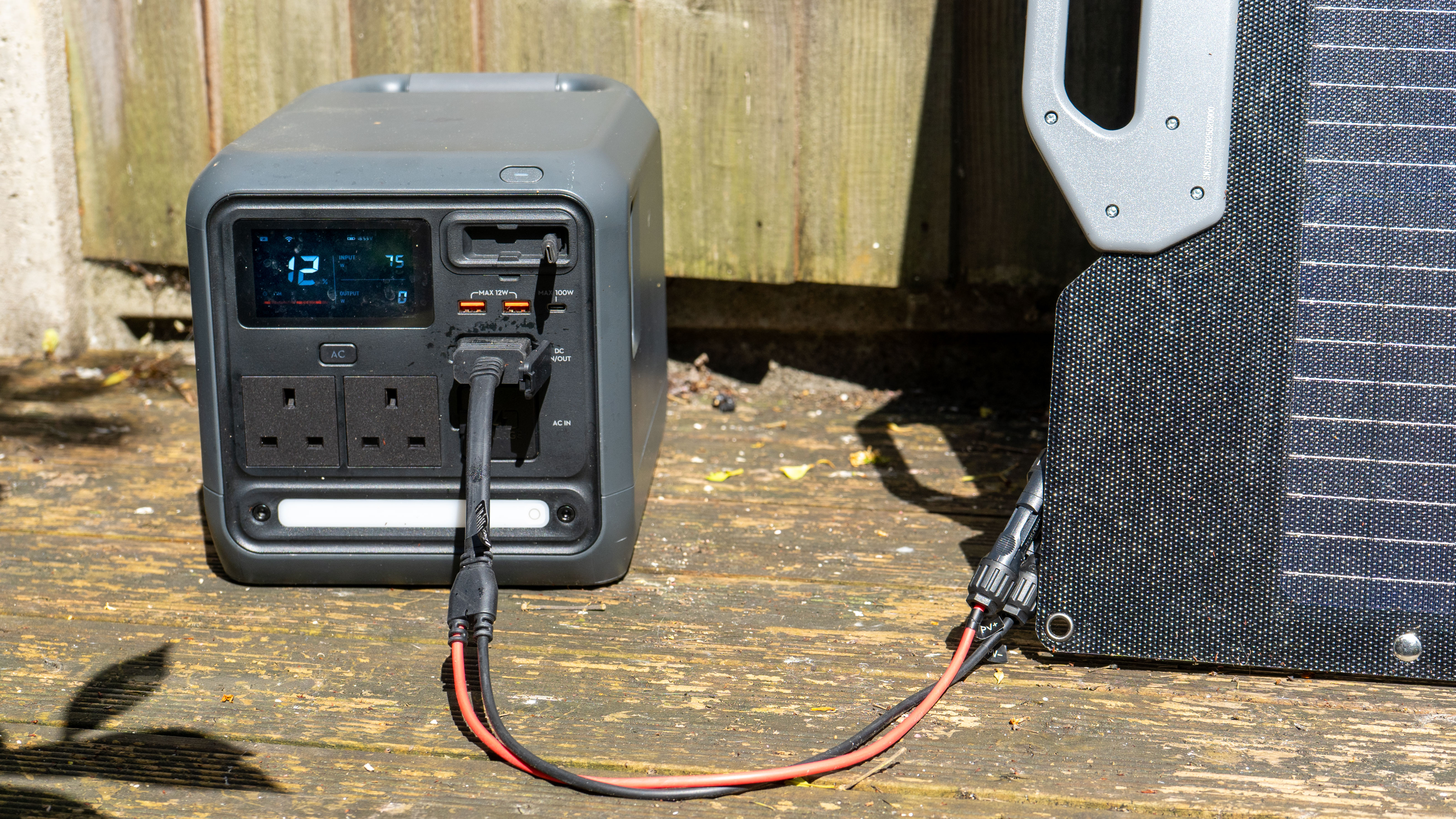 Power 1000 Mini Charging solar panel connected to it with cables