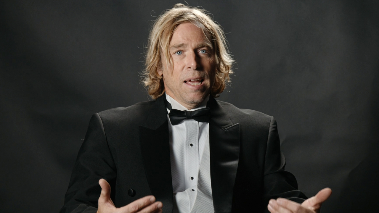 Dave England, longtime Jackass cast member, sits down for an interview that turns into a stunt in Jackass Forever (2022).
