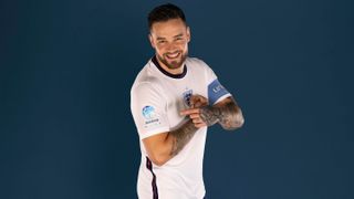 Soccer Aid 2022 - England Team captain Liam Payne points at the soccer aid logo on his sleeve