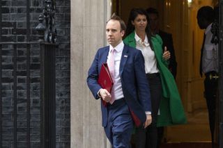Health Secretary Matt Hancock leaves 10 Downing Street with aide Gina Coladangelo after the daily press briefing on May 01, 2020 in London
