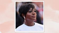 Viola Davis is pictured with a pixie-style haircut whilst attends the Red Carpet of the closing ceremony at the 77th annual Cannes Film Festival at Palais des Festivals on May 25, 2024 in Cannes, France/ in a pink watercolour paint-style template