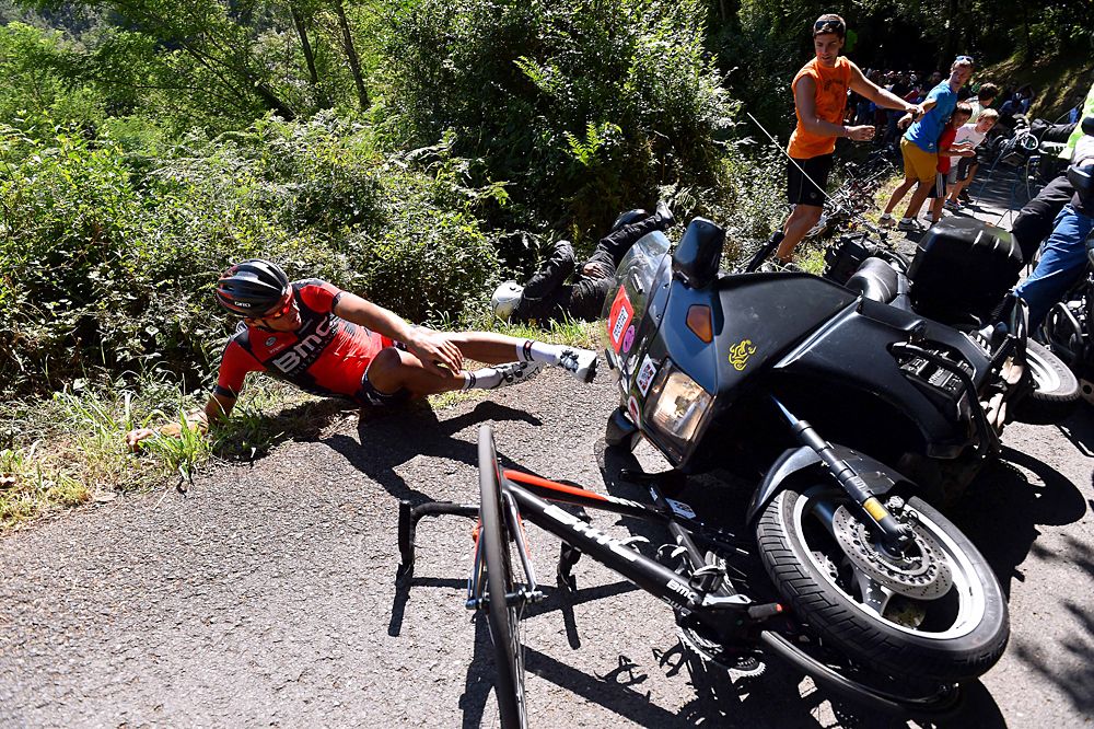 Greg Van Avermaet (BMC) hit by a TV motorcycle