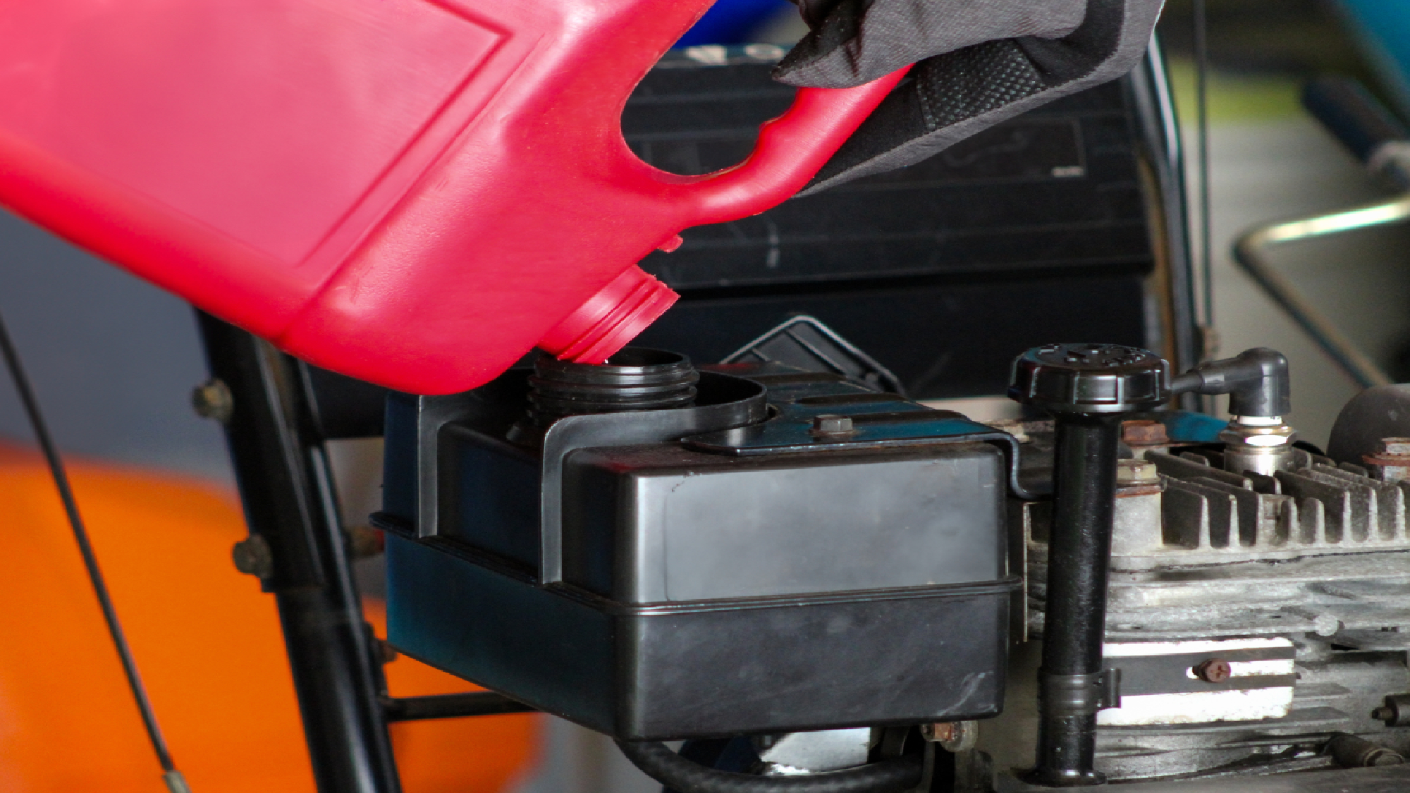 Gas being poured into snow blower