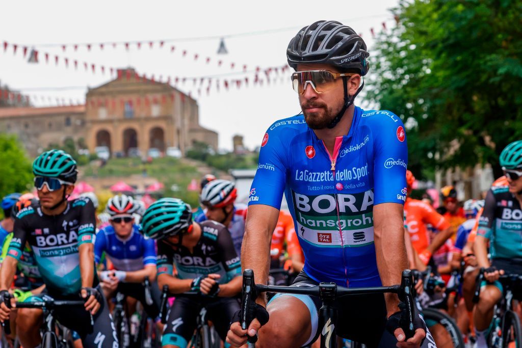 Team Bora rider Slovakias Peter Sagan R wearing the best climbers blue jersey waits with other riders on October 5 2020 prior to the start of the 3rd stage of the Giro dItalia 2020 cycling race a 150kilometer route between Enna and Etna Sicily Photo by Luca Bettini AFP Photo by LUCA BETTINIAFP via Getty Images