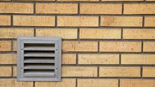 passive vent in yellow brick wall