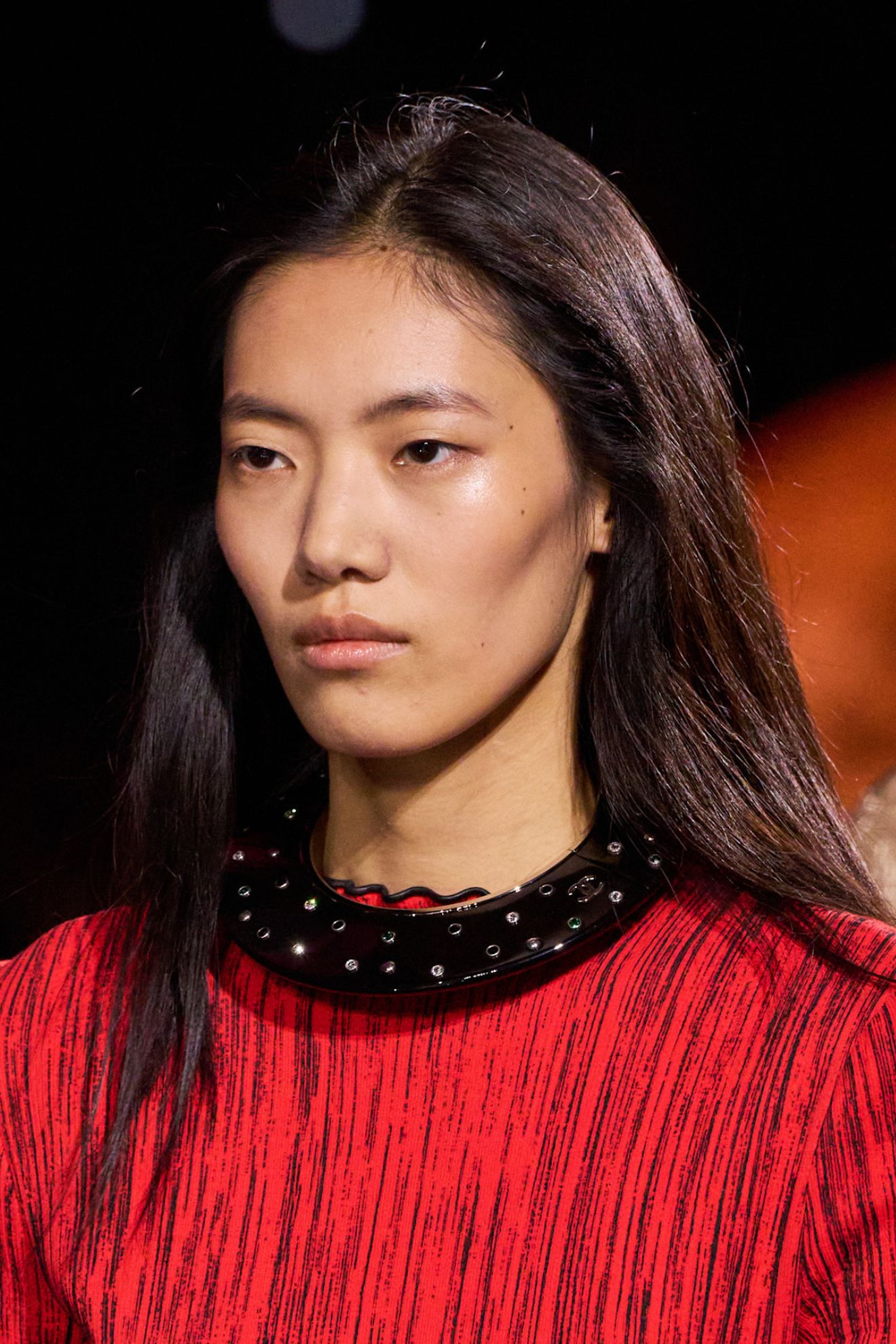 A model at the Paris SS26 Chanel show wearing minimal makeup