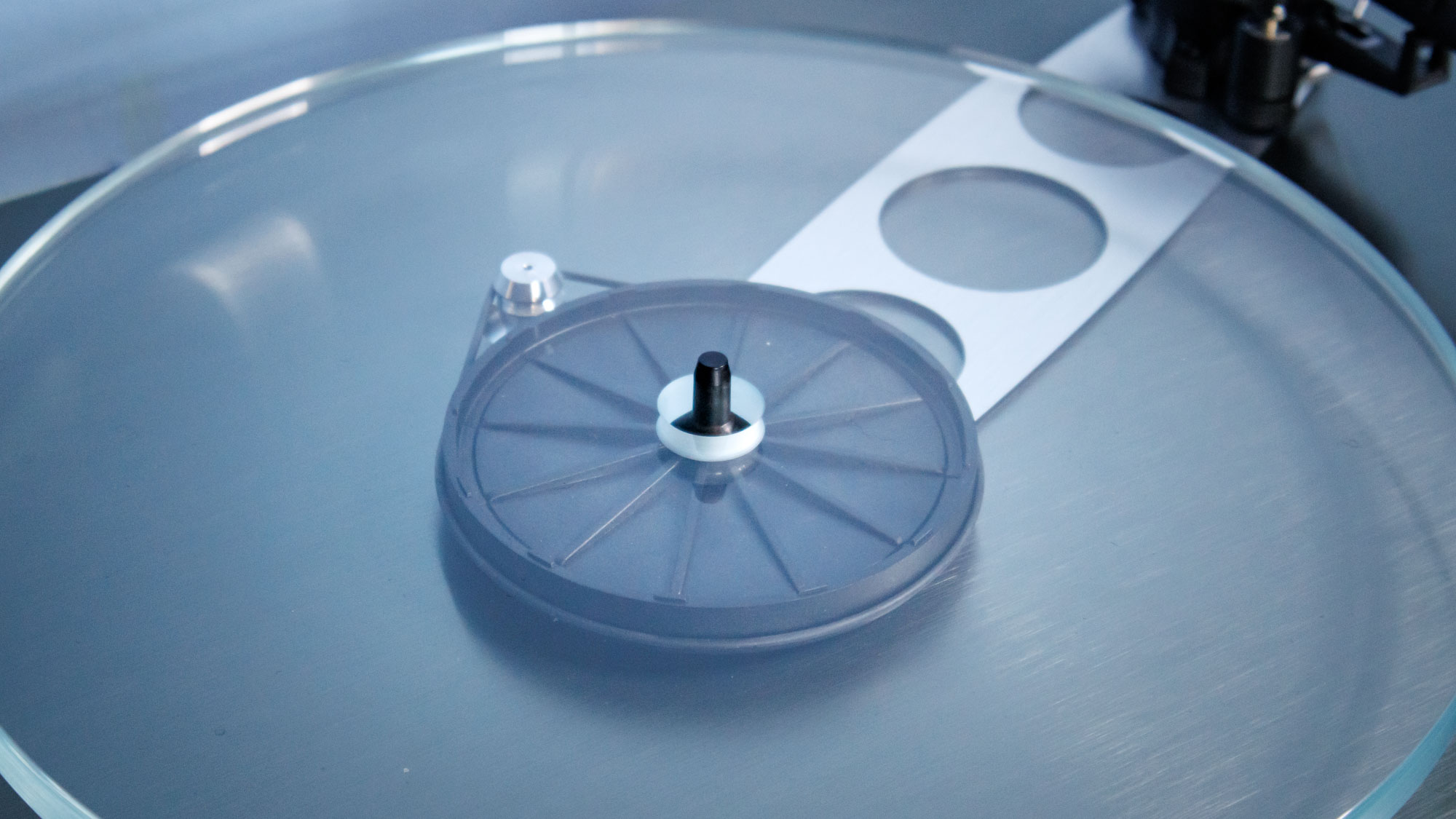 The Rega Planar 3 RS on an entertainment stand.