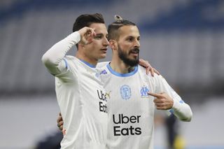 Dario Benedetto (left) celebrates his goal for Marseille