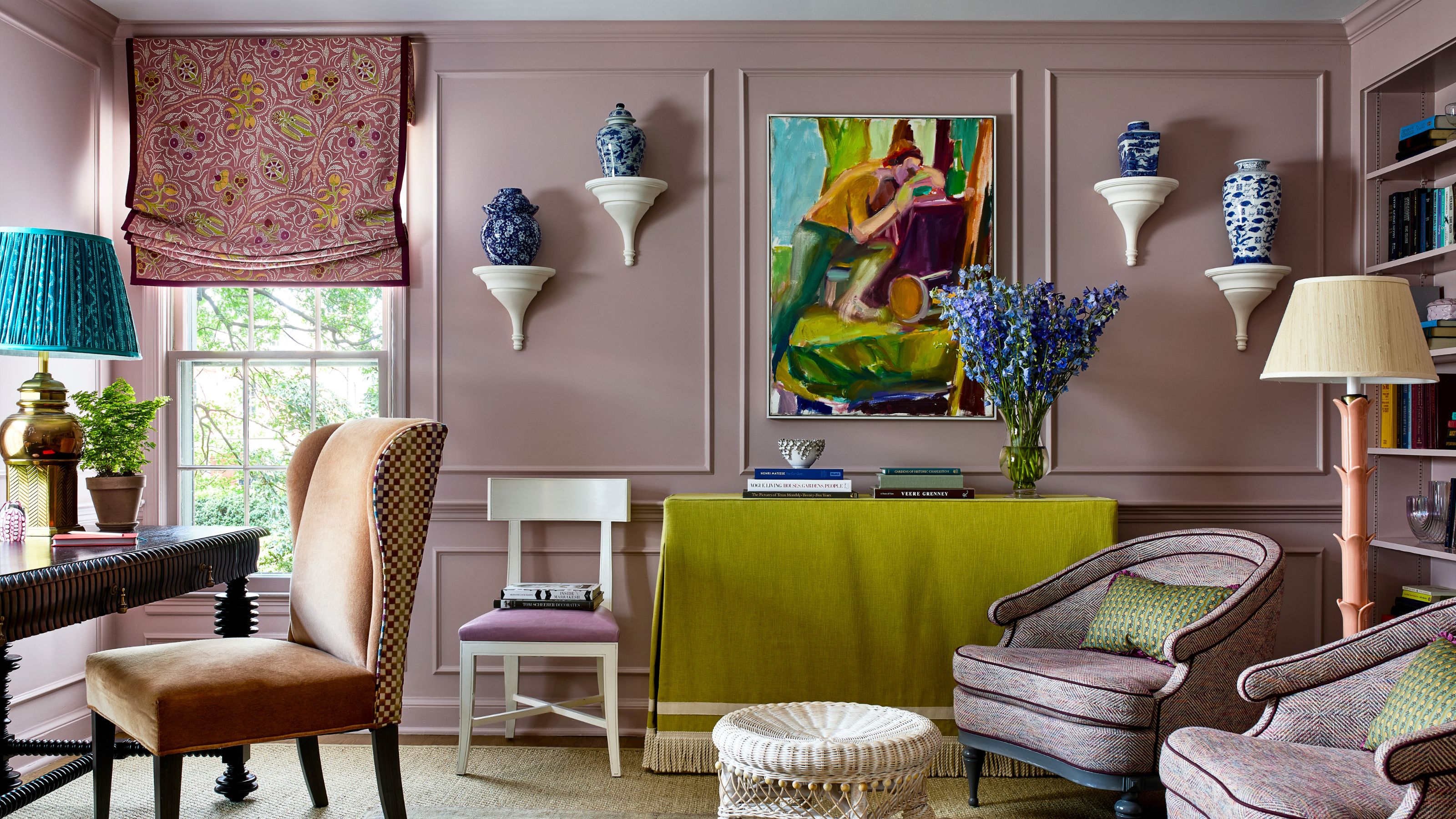 A mauve library room with blue accessories