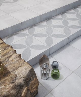 grey and white tiled steps and patio