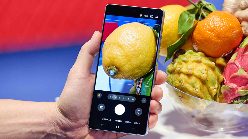 Samsung Galaxy S25 Ultra taking a close-up photo of a lemon in a fruit bowl