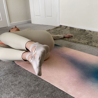 Katie Sims trying a Pilates spine twist supine every day