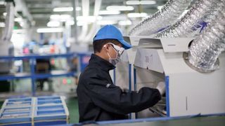 A factory supply chain employee at work