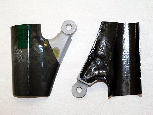 Aluminum hard points are integrally co-molded with the carbon fiber, making for a lighter, stiffer, and more reliable part.