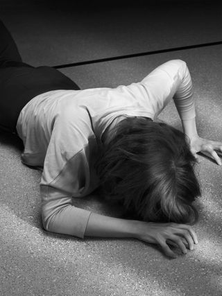 A person laid on the floor face down
