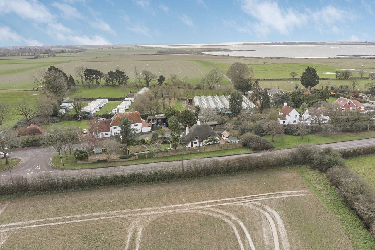 Images of the interiors and exteriors of The Thatched Cottage, Nutbourne