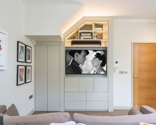 Home office showing a soundbar and TV lit up with special mood lighting