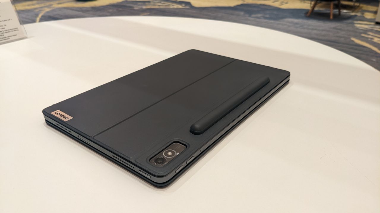 Lenovo Tab P11 Pro Gen 2 on a round wooden table.