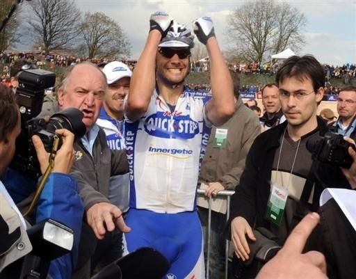 Boonen is mobbed by photographers and journalists after his triumph.