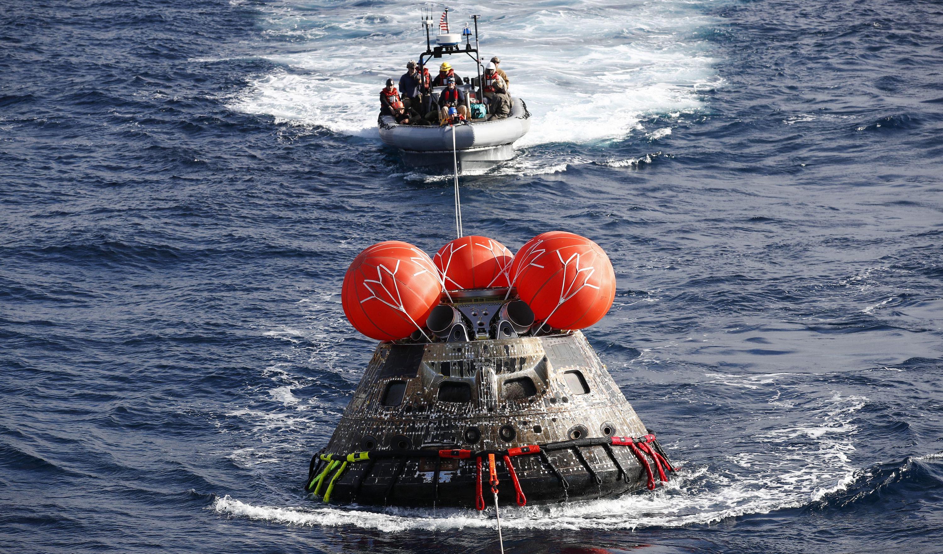 Orion being towed aboard the USS Portland.