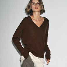 Woman in brown sweater